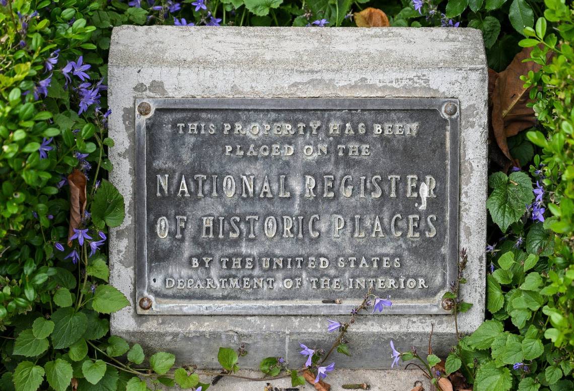 A plaque signifying the Meux home as being on the National Register of Historic Places, which occurred in 1975, sits on the ground just outside the front entrance of the home. CRAIG KOHLRUSS/ckohlruss@fresnobee.com