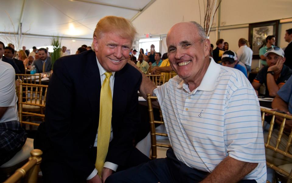 With Donald Trump at a golf event in 2015