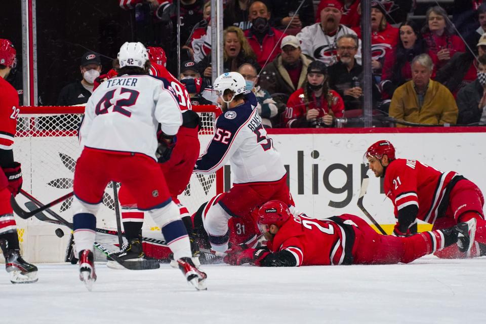 Jan 13, 2022; Raleigh, North Carolina, USA; Columbus Blue Jackets center Emil Bemstrom (52) scores a goal against the Carolina Hurricanes during the first period at PNC Arena. Mandatory Credit: James Guillory-USA TODAY Sports