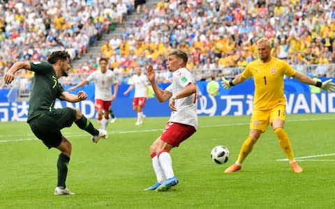 Australia's Mathew Leckie, left, tries to score past Denmark goalkeeper Kasper Schmeichel, right, during the group C match between Denmark and Australia at the 2018 soccer World Cup in the Samara Arena in Samara, Russia, Thursday, June 21, 2018 - Credit: AP