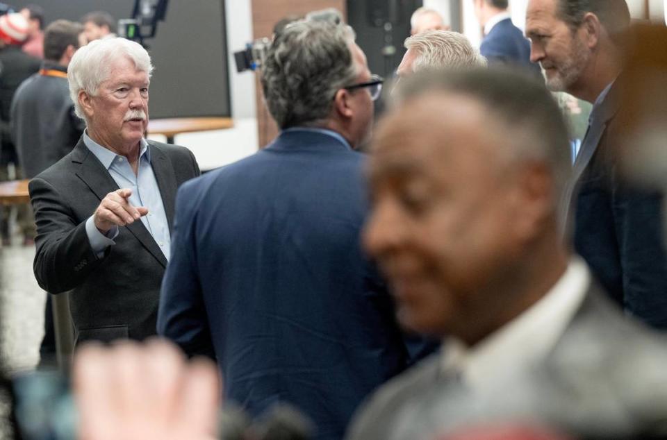 Kansas City Royals owner John Sherman points toward Jackson County Executive Frank White as he speaks to reporters during a press conference detailing proposed renovations to Arrowhead Stadium in February.