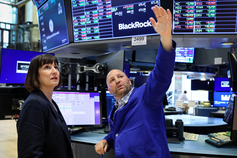 Rachel Reeves, Shadow Chancellor of the Exchequer, speaks with specialist trader John Parisi during a visit to the floor of the New York Stock Exchange (NYSE) in New York City, U.S., May 22, 2023.  REUTERS/Brendan McDermid