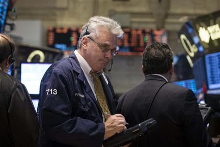 Traders work on the floor of the New York Stock Exchange April 15, 2014. REUTERS/Brendan McDermid