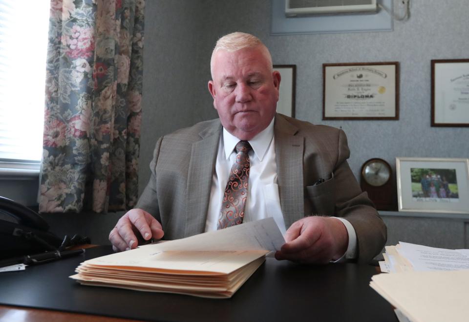 Keith Taylor, manager of Hannemann Funeral Home in Nyack, N.Y., says the coronavirus pandemic has turned him and his staff into "funeral director police."