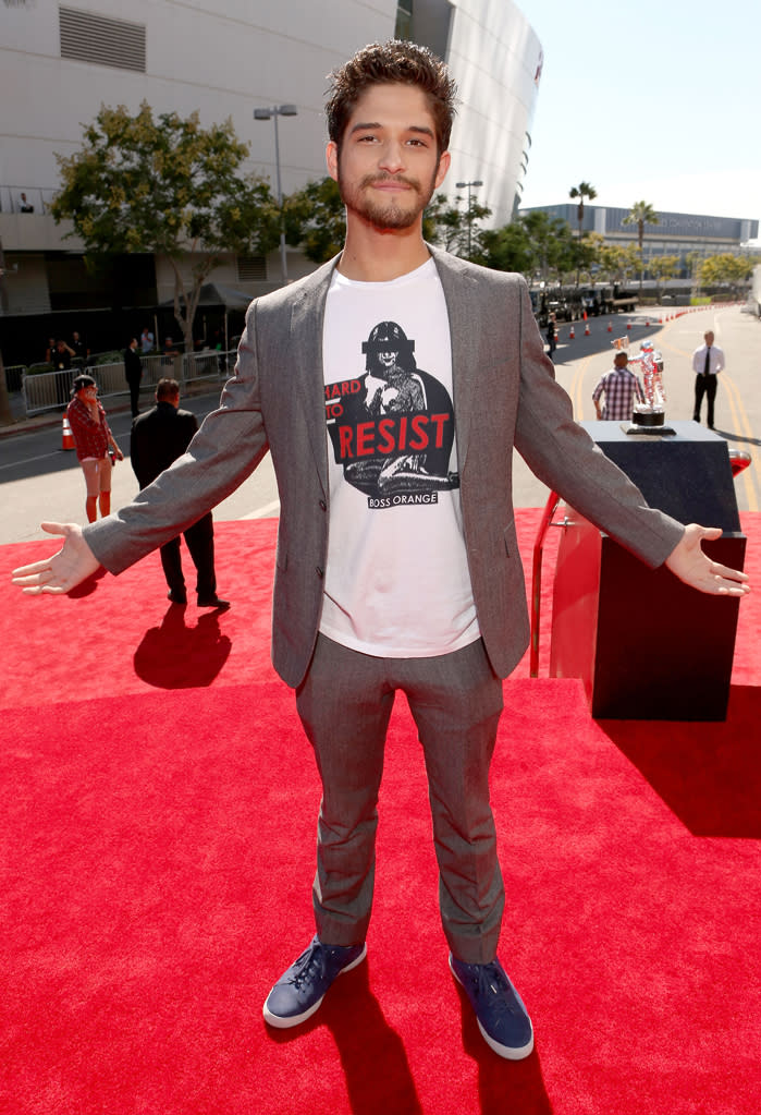 Tyler Posey, star of MTV’s “Teen Wolf,” paired his gray pants and suit jacket with a graphic white T-shirt – and of course some wolf-like facial hair!