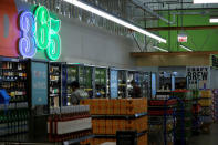 Employees arrange beer and wine at a 365 by Whole Foods Market grocery store is pictured ahead of its opening day in Los Angeles, U.S., May 24, 2016. REUTERS/Mario Anzuoni