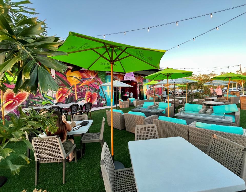 Plenty of comfortable seating can be found on the lawn at Backyard Social in Fort Myers.