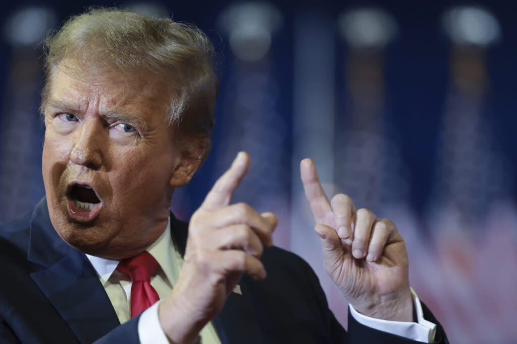 Republican presidential candidate and former President Donald Trump mocks U.S. President Joe Biden while speaking during a Get Out The Vote rally at Coastal Carolina University on Feb. 10, 2024, in Conway, South Carolina.