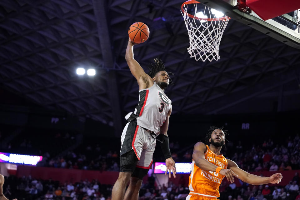 FILE - Georgia's Kario Oquendo (3) goes for a dunk next to Tennessee guard Josiah-Jordan James (30), but misses during the second half of an NCAA college basketball game Tuesday, March 1, 2022, in Athens, Ga. First-year Georgia coach Mike White says he likes the athleticism and competitiveness he has seen in practice. (AP Photo/Brynn Anderson)