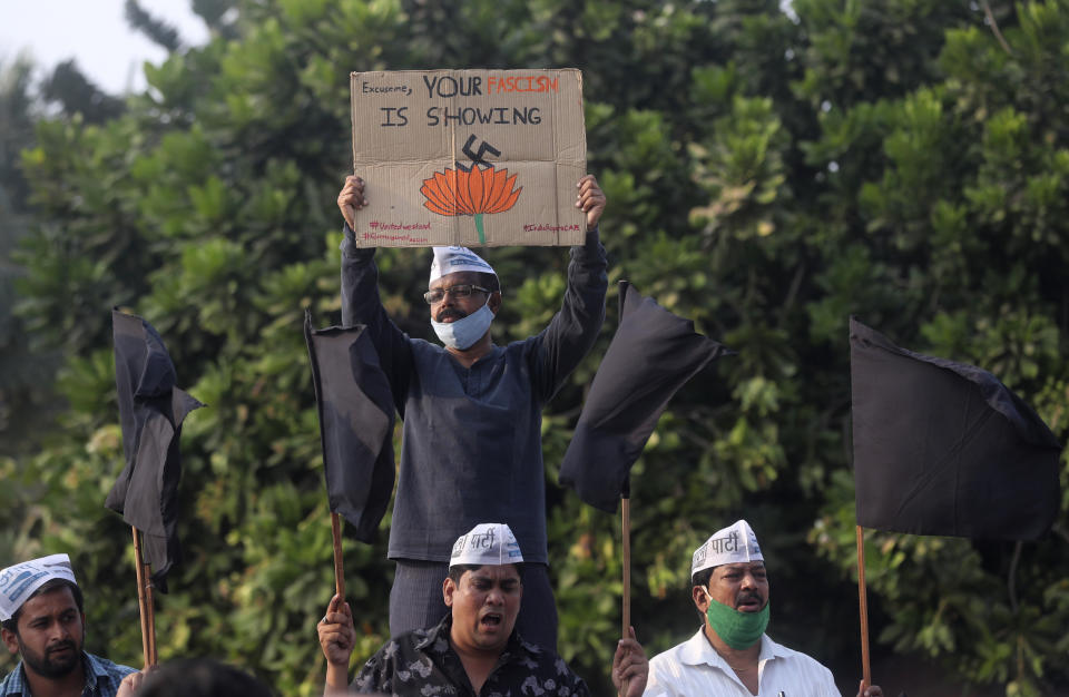 Members of Aam Aadmi Party shout slogans demanding the release of Indian climate activist Disha Ravi, during a protest in Mumbai, India, Monday, Feb. 15, 2021. The 22 years old activist was arrested Saturday for circulating a document on social media that allegedly incited protesting farmers to turn violent last month. (AP Photo/Rafiq Maqbool)