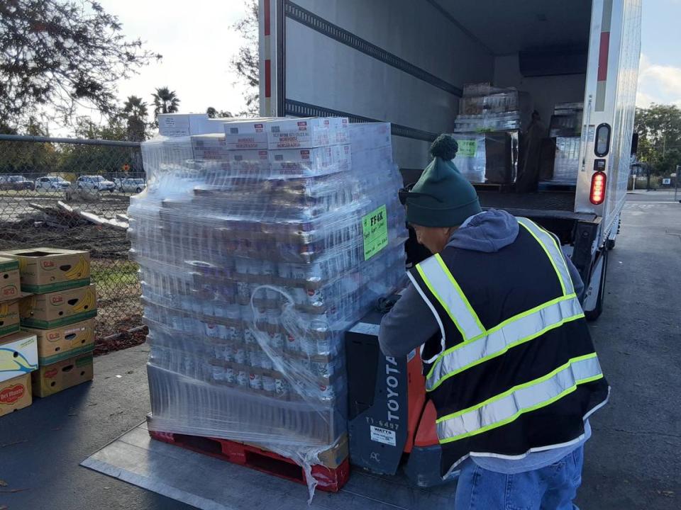 Second Harvest employee Manny Arechiga delivers food at Bret Harte Elementary School in south Modesto on Thursday, Nov. 10, 2022, for the food bank’s Fresh Food 4 Kids program.