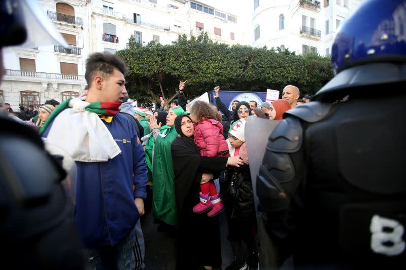 Demonstrators shout slogans during a protest calling to reject the upcoming presidential election in Algiers