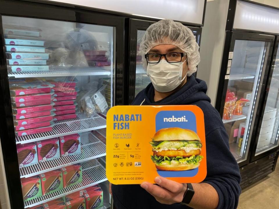 Ahmad Yehya, co-founder and CEO of Nabati Food displays one if the company's plant-based food products in its warehouse. (Travis McEwan/CBC - image credit)