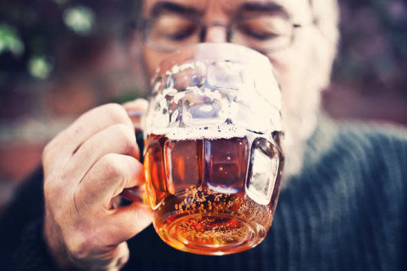 Man drinking traditional pint of real ale beer.