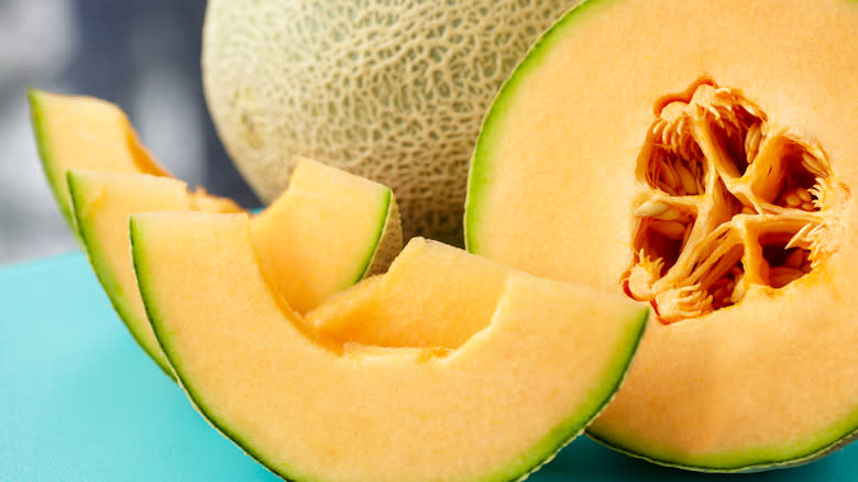 Sliced cantaloupe on cutting board