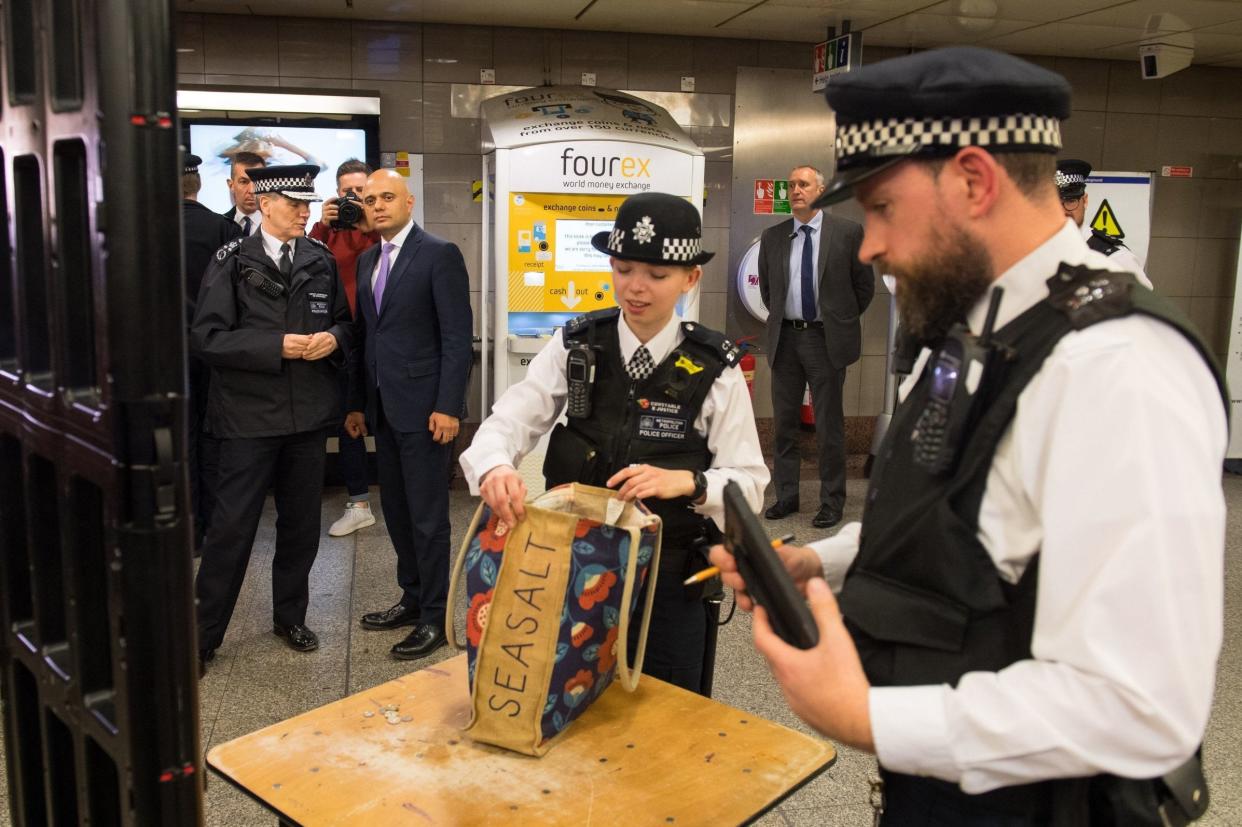 Sajid Javid observes a bag search during a visit to Angel underground station: PA