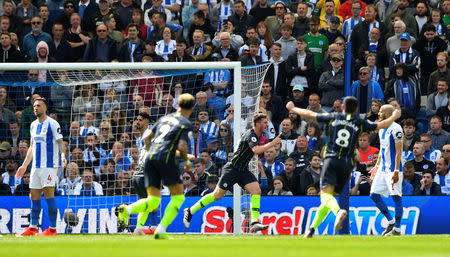 Soccer Football - Premier League - Brighton & Hove Albion v Manchester City - The American Express Community Stadium, Brighton, Britain - May 12, 2019 Manchester City's Aymeric Laporte celebrates scoring their second goal REUTERS/Toby Melville