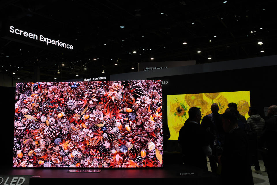 People tour a Samsung Micro LED exhibit at the Samsung booth during the CES tech show Tuesday, Jan. 9, 2024, in Las Vegas. (AP Photo/John Locher)