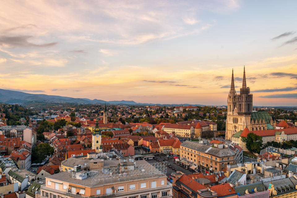 a view of the skyline in zagreb, croatia during sunset