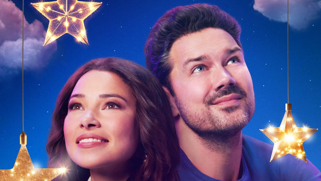  Ryan Paevey and Jessica Parker Kennedy on the promo poster for Under the Christmas Sky on Hallmark Channel. 