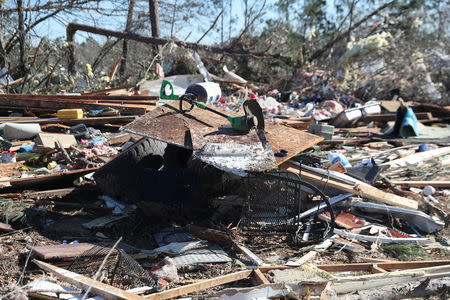 Debris lays outside a house devastated after two deadly back-to-back tornadoes, in Beauregard, Alabama, U.S., March 5, 2019. REUTERS/Shannon Stapleton