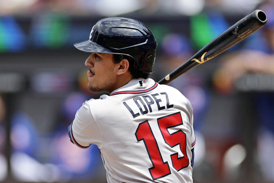 Atlanta Braves' Nicky Lopez hits a run scoring double against the New York Mets during the second inning in the first baseball game of a doubleheader on Saturday, Aug. 12, 2023, in New York. (AP Photo/Adam Hunger)