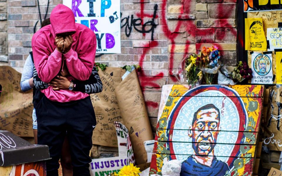 a makeshift memorial to George Floyd near the site where he died in police custody - Kerem Yucel/AFP