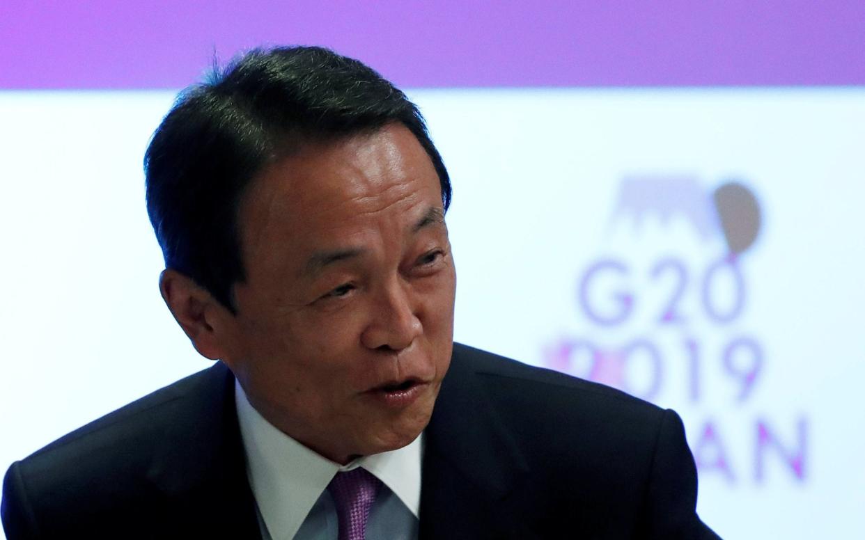 Taro Aso has sparked controversy with his comments -  ISSEI KATO/REUTERS