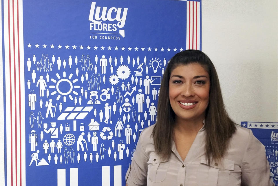 FILE - In this June 3, 2016, file photo, Lucy Flores poses for a photo at her North Las Vegas campaign headquarters. Flores, the former Nevada politician who accused Joe Biden of inappropriately kissing her on the back of the head in 2014, rose from a tough childhood through top Nevada political circles before becoming an outspoken critic about sexism and harassing behavior in politics. (AP Photo/Michelle Rindels, File)