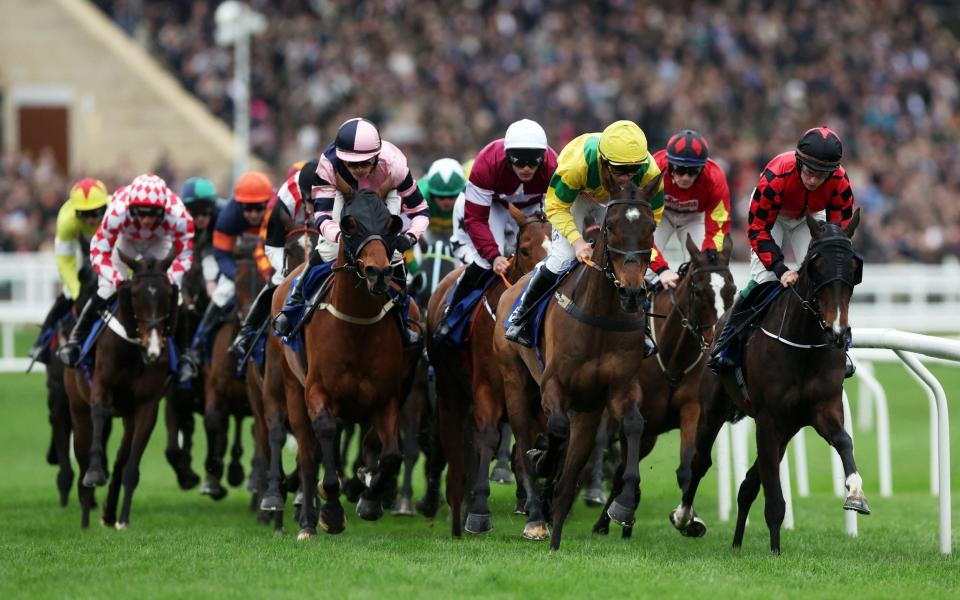 Monmiral ridden by Harry Cobden in action as he leads the 14:10 Pertemps Handicap Hurdle