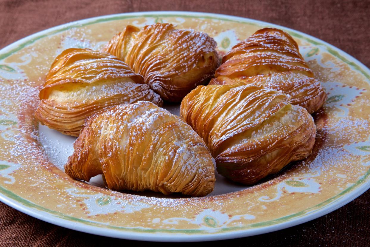 Sfogliatelle on a plate.