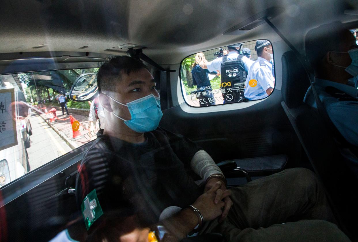 File: Hong Kong defendant Tong Ying-Kit, 24, arrives at court after being accused of deliberately driving his motorcycle into a group of police officers last Wednesday on 6 July, 2020 (Getty Images)