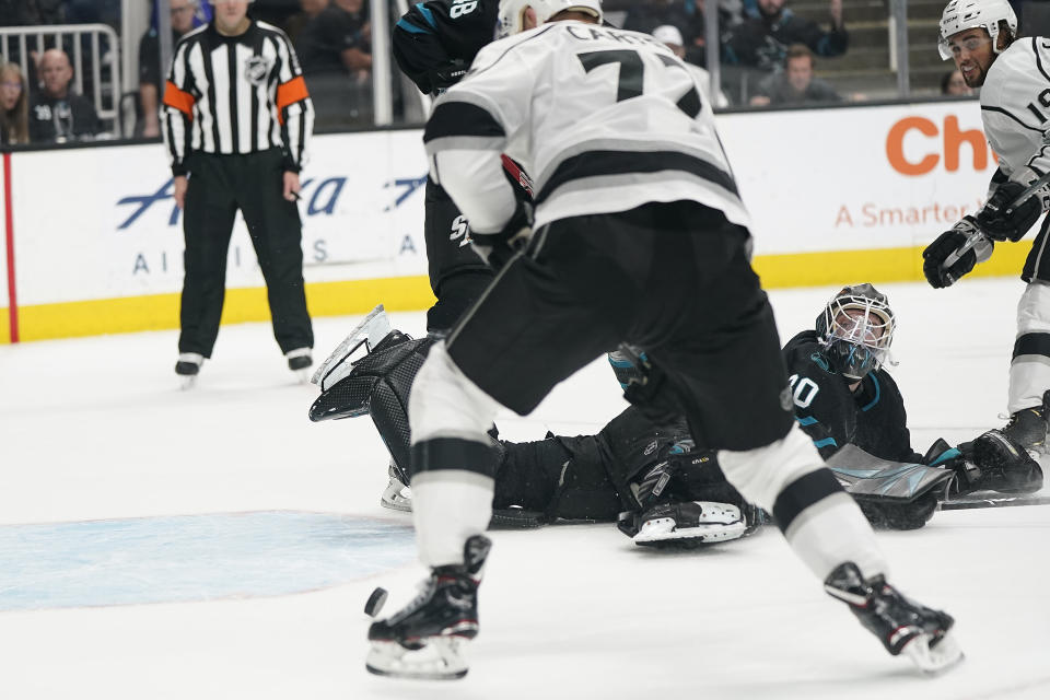 San Jose Sharks goaltender Aaron Dell (30) looks back as Los Angeles Kings center Jeff Carter (77) scores in overtime in an NHL hockey game in San Jose, Calif., Friday, Dec. 27, 2019. The Kings won 3-2. (AP Photo/Tony Avelar)