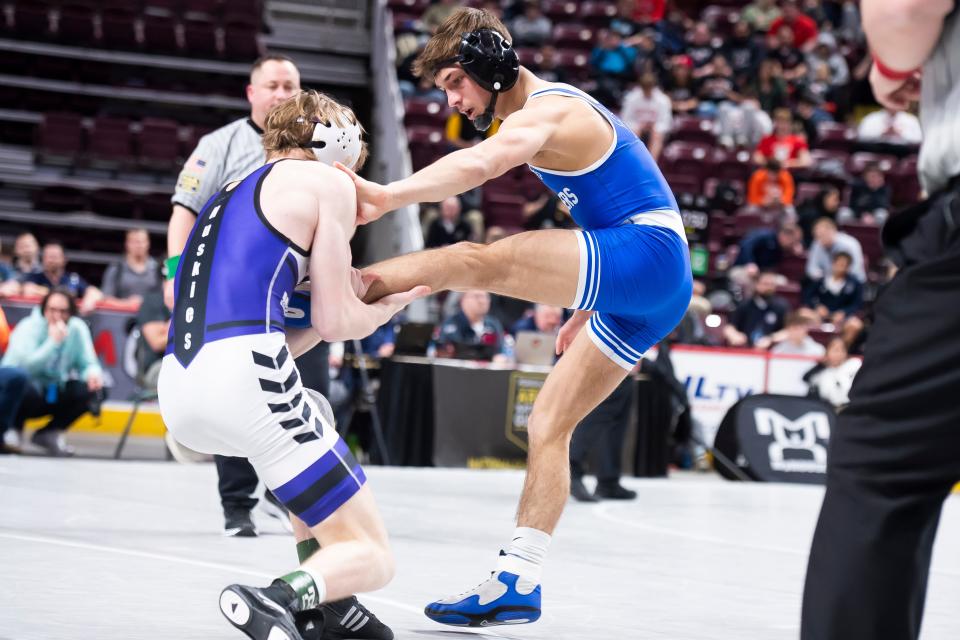 Quakertown's Mason Ziegler (right), shown here competing at the PIAA championships last season, placed second in Hershey at 121 pounds.