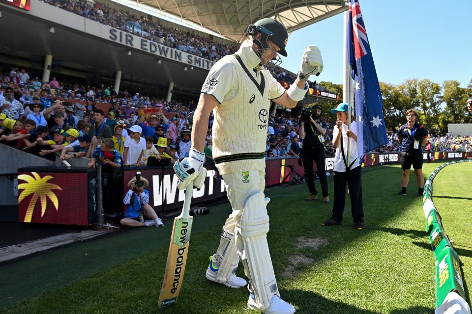 Steve Smith walks out onto the field.