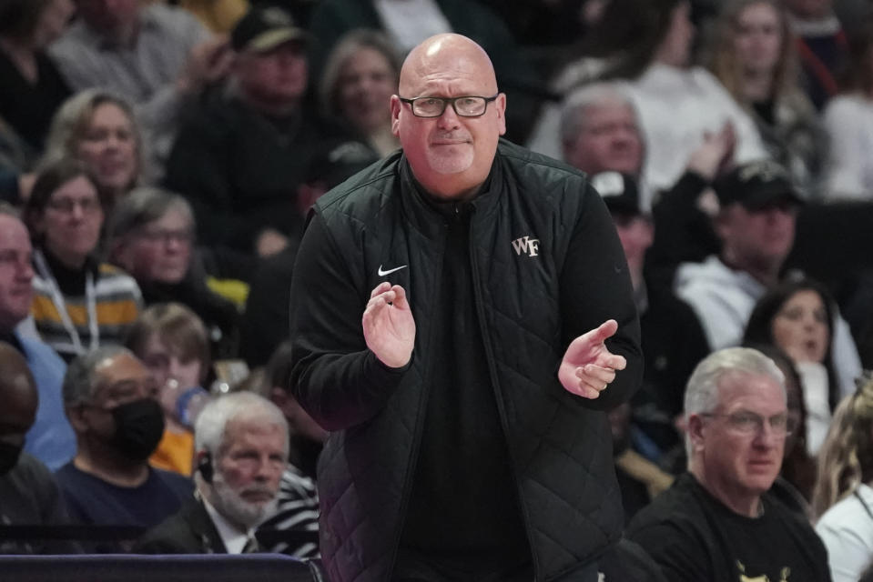 FILE - Wake Forest head coach Steve Forbes cheers on his team during the second half of an NCAA college basketball game against Virginia in Winston-Salem, N.C., Jan. 21, 2023. The Wake Forest Demon Deacons are trying to return to the NCAA Tournament for the first time since 2017. (AP Photo/Chuck Burton, File)