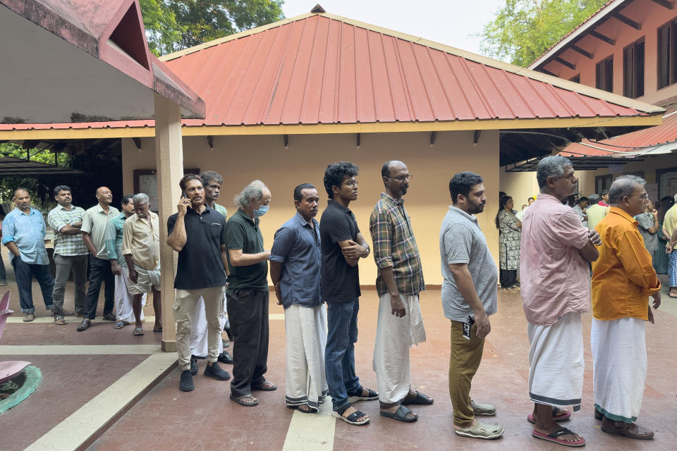 People queue up to vote during the second round of voting in the six-week long national election outside a polling booth in Kochi, southern Kerala state, India, Friday, April 26, 2024. (AP Photo/R S Iyer)
