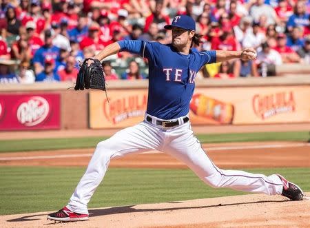 Oct 4, 2015; Arlington, TX, USA; Texas Rangers starting pitcher Cole Hamels (35) pitches against the Los Angeles Angels during the first inning at Globe Life Park in Arlington. Mandatory Credit: Jerome Miron-USA TODAY Sports