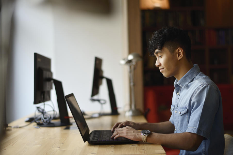 Young man working in a co-working office