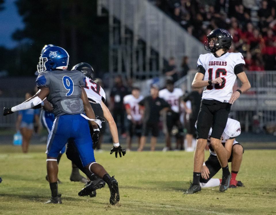 Jackson Clarke (16) kicks a field goal to give the Jaguars a 3-0 lead during the West Florida vs Washington football game at Booker T. Washington High School in Pensacola on Friday, Sept. 2, 2022.