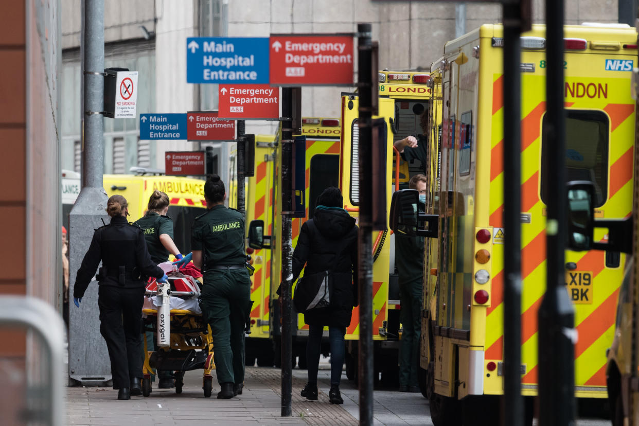 Paramedics transport a patient with visible oxygen tank from the ambulance to the emergency department at the the Royal London Hospital, on 15 January, 2021 in London, England. Hospitals across the country are dealing with an ongoing rise in Covid-19 cases, providing care to more than 35,000 people, which is around 50% more than at the peak of the virus in spring, with fears that hospitals in London may be overwhelmed within two weeks unless the current infection rate falls. (Photo by WIktor Szymanowicz/NurPhoto via Getty Images)