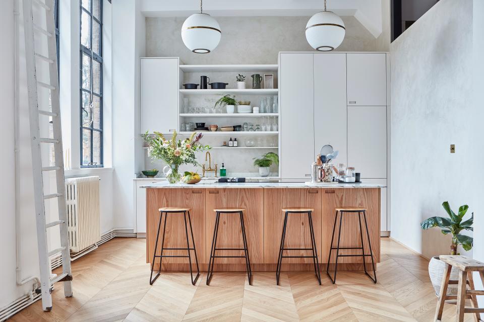 "Anna needed as much worktop space as possible, so we designed a large island," says George. "We carefully aligned the position of the fridge, sink, and cooker, which makes moving around the space efficient and logical."