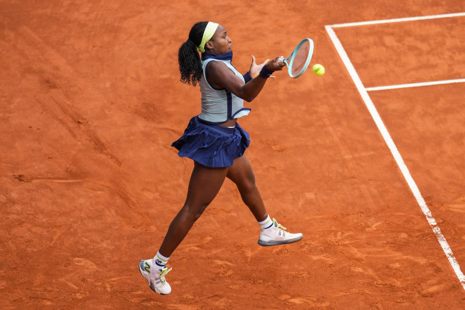 Coco Gauff of the United States returns the ball to Arantxa Rus of Netherlands during the Mutua Madrid Open tennis tournament in Madrid, Thursday, April 25, 2024. (AP Photo/Manu Fernandez)