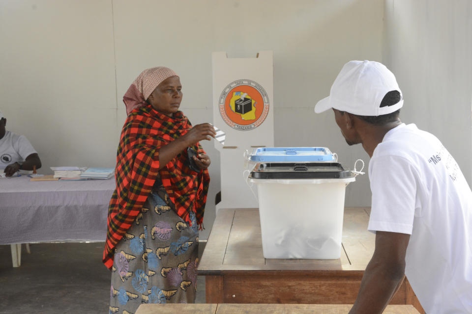 A woman casts her vote Wednesday, Oct. 28, 2020, in Dodoma Tanzania, for a presidential election that the opposition warns is already deeply compromised by manipulation and deadly violence. (AP Photo)