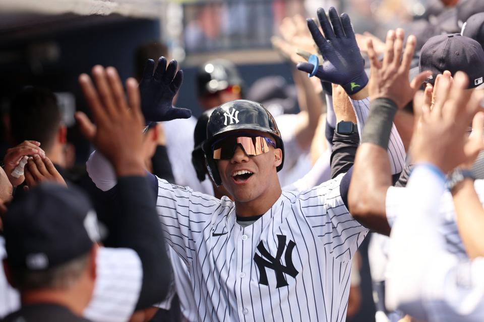 Mar 10, 2024; Tampa, Florida, USA; New York Yankees left fielder Juan Soto (22) is congratulated after hitting a three run home run during the fourth inning against the Atlanta Braves at George M. Steinbrenner Field. Mandatory Credit: Kim Klement Neitzel-USA TODAY Sports