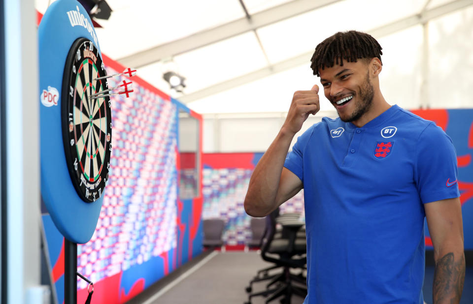 <p>England's Tyrone Mings plays darts with media following the press conference at St George's Park, Burton upon Trent. Picture date: Tuesday June 15, 2021.</p>
