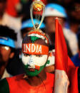 Indian cricket fan, Sudhir Kumar painted in the colours of the Indian flag, and player Sachin Tendulkar's name on his chest, during the 2011 ICC World Cup second Semi-Final between India and Pakistan at Punjab Cricket Association (PCA) Stadium on March 30, 2011 in Mohali, India.