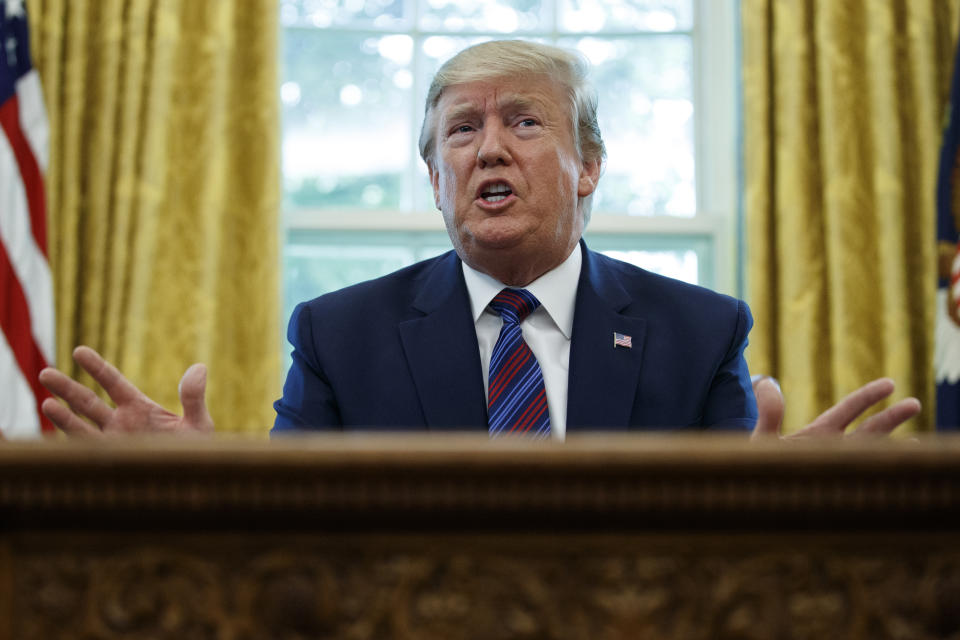 President Donald Trump speaks in the Oval Office of the White House in Washington, Friday, July 26, 2019. Trump announced that Guatemala is signing an agreement to restrict asylum applications to the U.S. from Central America.(AP Photo/Carolyn Kaster)