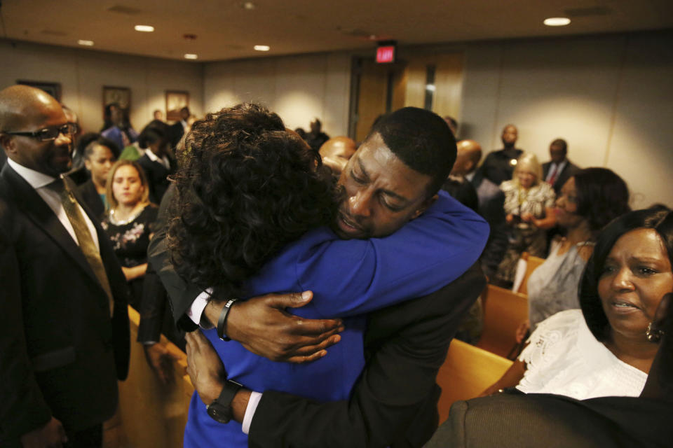 Odell Edwards, father of Jordan Edwards, gets a hug from Dallas County district attorney Faith Johnson after hearing a guilty of murder verdict during the ninth day of the trial of fired Balch Springs police officer Roy Oliver, who was charged with the murder of 15-year-old Jordan Edwards, at the Frank Crowley Courts Building in Dallas on Tuesday, Aug. 28, 2018. (Rose Baca/The Dallas Morning News via AP, Pool)