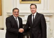 Britain's Prime Minister David Cameron (R) shakes hands with US Secretary of State for Defence Leon Panetta before a meeting at number 10, Downing Street, in central London on January 18, 2013. Islamist hostage-takers at a remote Algerian gas field on Friday demanded a prisoner swap and an end to the French military campaign in Mali, a report said